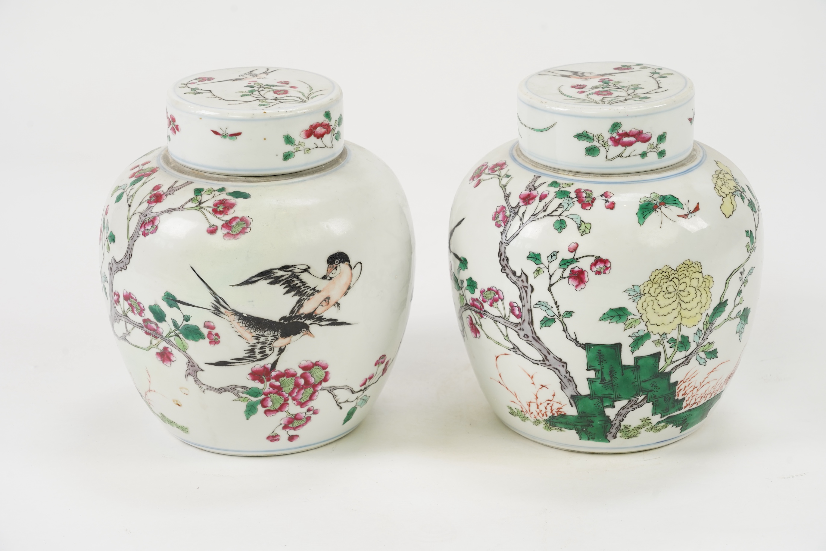 A pair of Chinese famille rose jars and covers, Kangxi mark but late 19th/early 20th century